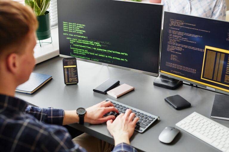 Software developer working with codes on computer
