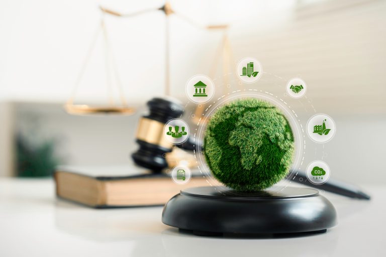 world and wooden gavel with a golden scale for law international environmental concept of business corporate and industry. law world for environmental regulation