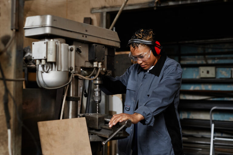 Woman At Metalworking Factory