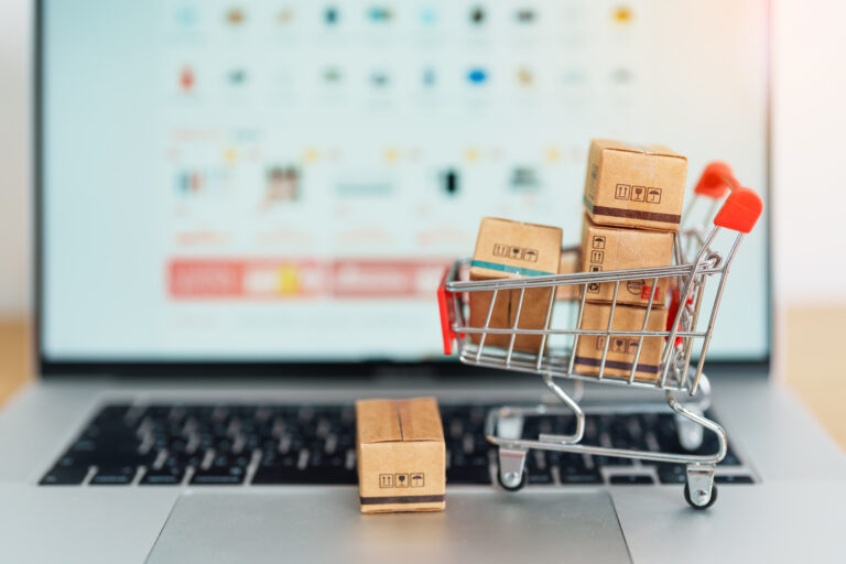 Boxes with shopping cart on a laptop computer