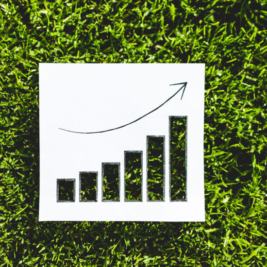 circular economy and sustainable development increasing in popularity conceptual image, graph with positive growth statistics on green grass with cut outs